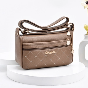 Brown soft PU leather crossbody bag with diamond stitching and heart embossed details