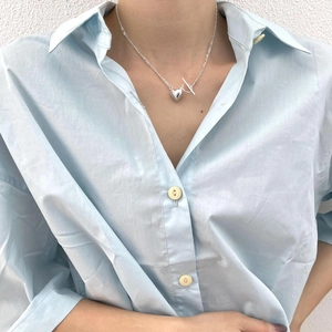 Silver S925 sterling silver heart necklace with unique OT toggle clasp on a female model