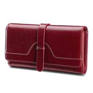 Deep red vintage oil wax leather long wallet with white stitching on white background