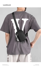 Rear view of model wearing a black waterproof nylon crossbody bag with adjustable strap