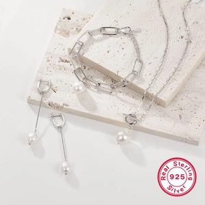Elegant 925 sterling silver jewelry set featuring freshwater pearl necklace and bracelet