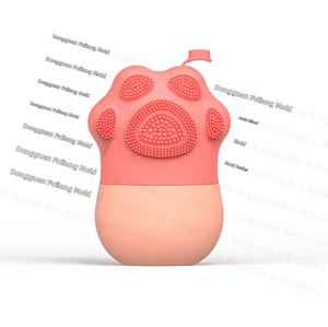 Detail view of cat claw silicone massage brush with soft exfoliating pink bristles
