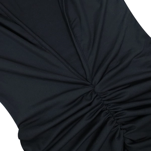 Detailed close-up of the black V-neck dress featuring ruched center design and soft fabric