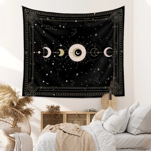 Astrological sun and moon phase wall tapestry with gold celestial stars on black fabric