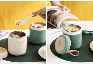 Close-up of insulated stainless steel soup mugs in off-white and dark green colors