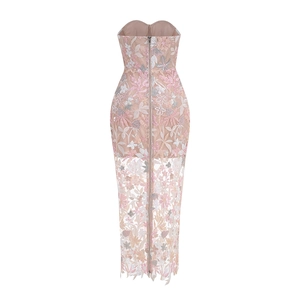 Detail of floral embroidery and back zipper on a strapless nude pink evening gown