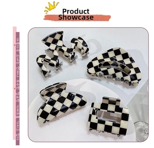 Set of four checkerboard hair claws in wavy, triangle, bow, and rectangular shapes