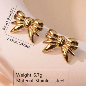 Detail of gold bow earrings with stainless steel specs showing 2.47cm width and 6.7g weight