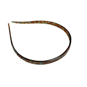 Slanke acetaat hoofdband met vintage schildpadmarmerpatroon in amber en blauwe kleuren