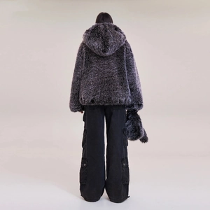 Rear view of a fuzzy grey faux fur hooded jacket styled with black multi-pocket cargo pants