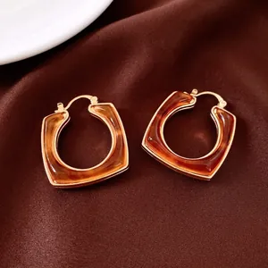 18k gold plated resin square hoop earrings with amber tortoiseshell pattern on silk