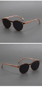 Detail view of vintage round sunglasses with faux wood temples and tortoise shell frame