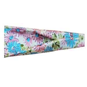 Close-up of pink and blue floral pattern on soft athletic sweatband fabric