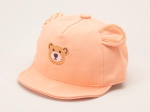 Detail of peach cotton baby baseball cap featuring 3D bear ears and embroidery