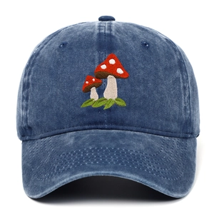 Detail of red mushroom embroidery on vintage navy blue washed denim baseball cap