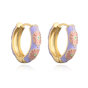 Detail of gold-plated hoop earrings with purple enamel and pink daisy floral patterns