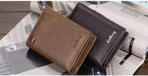 Vertical leather wallets in light and dark brown shown on an open magazine background