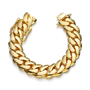 Macro shot of 18k gold plated Cuban link bracelet showing high-gloss metal finish and clasp