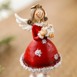 Resin Christmas angel girl figurine in red and white holding a white gift box decoration
