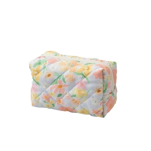 Light blue floral quilted cotton makeup bag with zipper and delicate small flower pattern