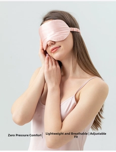 Detailed view of pink silk sleep mask with elastic strap for comfort and light blocking