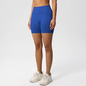 Close-up of bright blue seamless high-waisted fitness shorts with elastic wide waistband