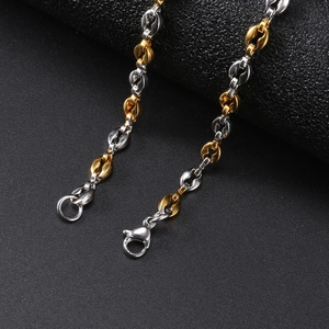 Macro shot of 4.5mm gold and silver two-tone stainless steel coffee bean link chain with clasp