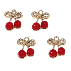 Four red cherry pendants with gold bows and sparkling crystals on a white background
