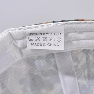 Detail view of the 100% polyester label and internal stitching of the baseball cap