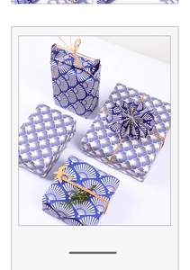 Close-up of blue Japanese wave pattern gift wrapping paper with decorative twine ties