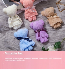 Close-up of five colorful microfiber towels folded into cute bear shapes for gifts