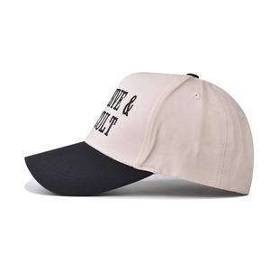 Detail of high-density cotton baseball cap featuring contrast brim and side embroidery