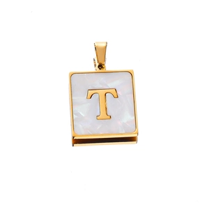 Macro shot of 22mm gold square letter T pendant with white mother-of-pearl inlay