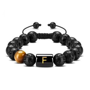 Detailed view of volcanic stone bracelet featuring tiger eye bead and letter F charm