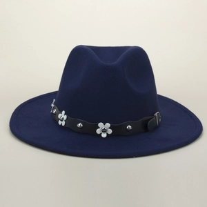 Detail of dark blue wool fedora with floral leather band and silver rivet accents