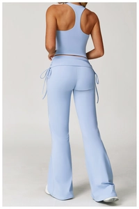 Detail view of high-waist yoga set with drawstring waist side and cross back top