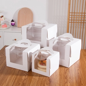 Set of four white paper cake boxes with transparent windows and carrying handles