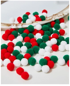 Close-up of soft red green and white Christmas plush pom-poms for DIY crafts and decor