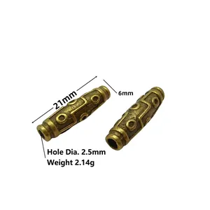 Detail of 21mm antique bronze barrel beads with embossed patterns for DIY jewelry