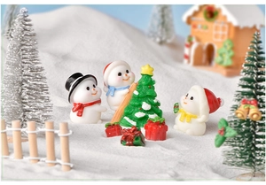Christmas miniature set with cute snowmen, small pine tree, gift boxes and wooden fence