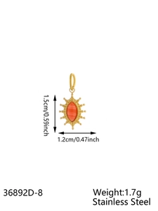 Detail view of a 1.7g gold-plated stainless steel sun pendant with orange gemstone
