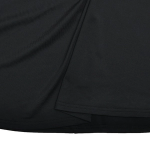 Close-up of the double-needle stitching and hem detail on a black bodycon dress