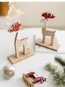 Detailed view of handcrafted wooden reindeer decor with red antlers in festive home setting