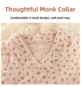 Detail view of baby floral romper with cross-over V-neck and soft cotton gauze texture