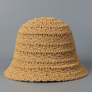 Close-up of khaki woven bucket hat featuring detailed straw texture and breathable mesh pattern