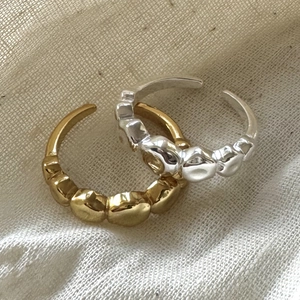 Minimalist 925 sterling silver irregular open rings in gold and silver finish on linen