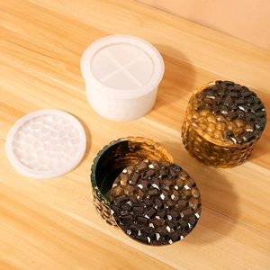 Detail showing silicone stackable cylinder mold and geometric resin container results