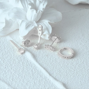 Macro shot showing 925 silver hallmarks on the Evil Eye earrings and stud accessories