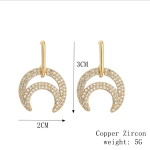 Detailed view of moon earrings with dimensions 3CM by 2CM and copper zircon material