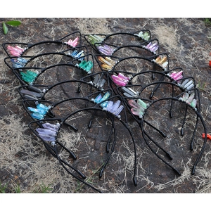 Detail of cat ear headbands with colorful raw crystal points on black wire frames